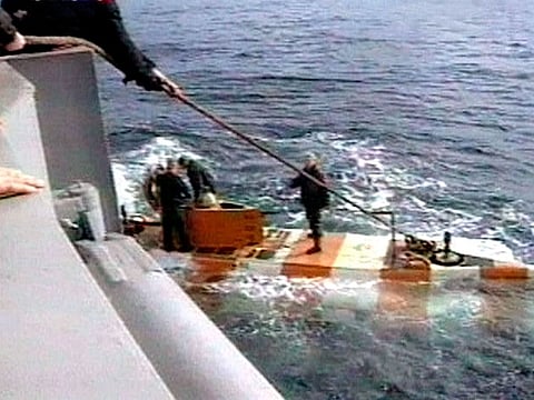 In this video grab provided by the RU-RTR Russian television via APTN , Russia rescue personnel return from a dive in a mini submarine to the Kursk on the sea bed in the Barents Sea, Russia.