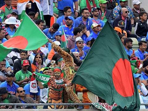 Spectators cheer during the 2019 Cricket World Cup group stage match between Bangladesh and India at Edgbaston in Birmingham, on July 2, 2019.