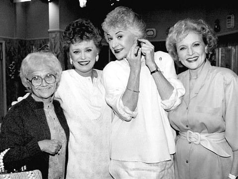 FILE - This Dec. 25, 1985 file photo shows the stars of the television series "The Golden Girls" , from left, Estelle Getty, Rue McClanahan, Bea Arthur and Betty White during a break in taping in Hollywood, Calif. The sitcom, which followed four women of a certain age living together in Miami, aired on NBC from 1985 to 1992. Nearly 35 years later, it continues to gain new fans and has inspired a wave of merchandising. (AP Photo/Nick Ut, File)