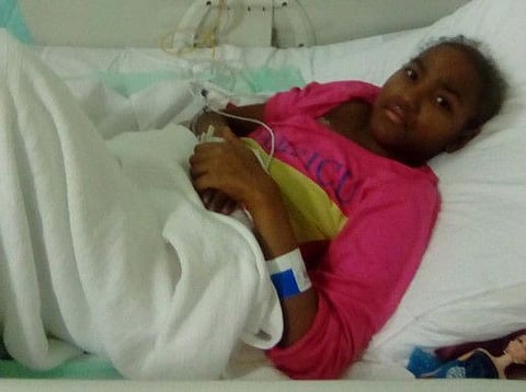 One of identical twin sisters, 12-year-old Hana shuttles between hospital and home to save on medical bills.