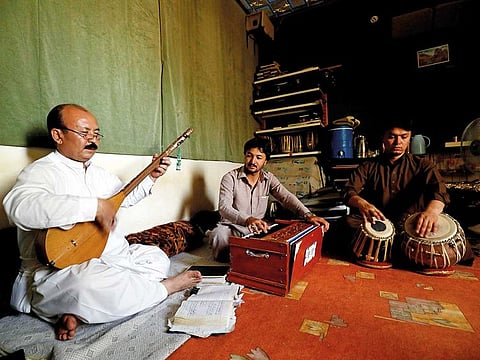 Mir Hussain Changazi plays Damboora along with Fida Hussain playing Harmonium and Zia Noorband on Tabla at Aahanga musical academy in Quetta.