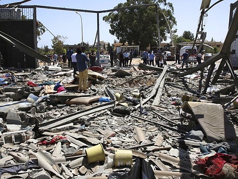Debris covers the ground after an airstrike at a detention center in Tajoura, east of Tripoli in Libya, Wednesday, July 3, 2019.