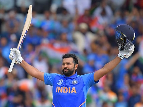 India's Rohit Sharma celebrates after reaching his century during the 2019 Cricket World Cup group stage match between Sri Lanka and India at Headingley in Leeds, northern England.