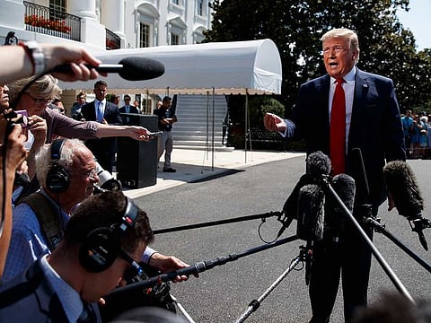 President Donald Trump talks to reporters on the South Lawn of the White House before departing for his Bedminster, N.J. golf club, Friday, July 5, 2019, in Washington.