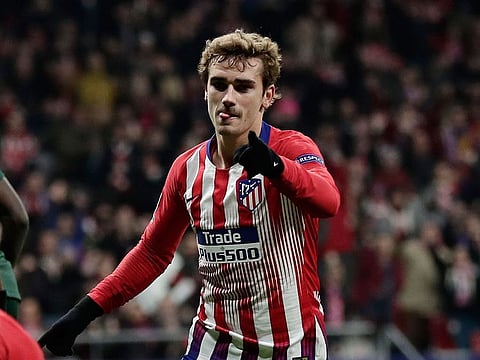 In this Wednesday, Nov. 28, 2018 file photo, Atletico forward Antoine Griezmann after scoring his side's second goal during a Group A Champions League soccer match between Atletico Madrid and Monaco at the Metropolitano stadium in Madrid.