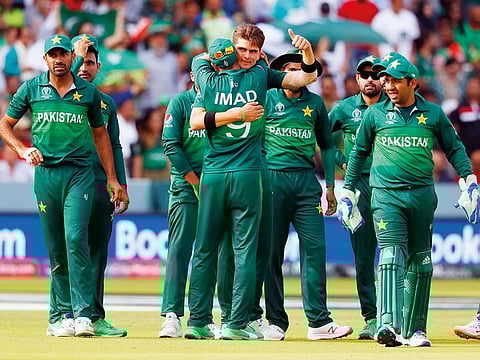 Pakistan's Shaheen Afridi, centre gives a thumbs up as he celebrates with teammates after taking the wicket of Bangladesh's Mahmudullah during the Cricket World Cup match between Pakistan and Bangladesh at Lord's cricket ground in London.