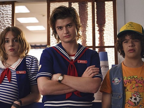 From left, Robin (Maya Hawke), Steve (Joe Keery) and Dustin (Gaten Matarazzo) are standouts in Season 3 of “Stranger Things.” MUST CREDIT: Netflix