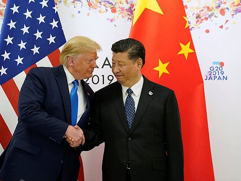 US President Donald Trump shakes hands with China's President Xi Jinping before starting their bilateral meeting during the G20 leaders summit in Osaka, Japan, on June 29, 2019.