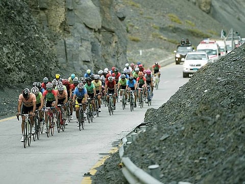 In this picture taken on June 30, 2019, Pakistani and international cyclists take part in the Tour de Khunjerab