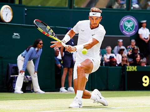 Spain's Rafael Nadal returns to Portugal's Joao Sousa in a Men's singles match during day seven of the Wimbledon Tennis Championships in London, on July 8, 2019.