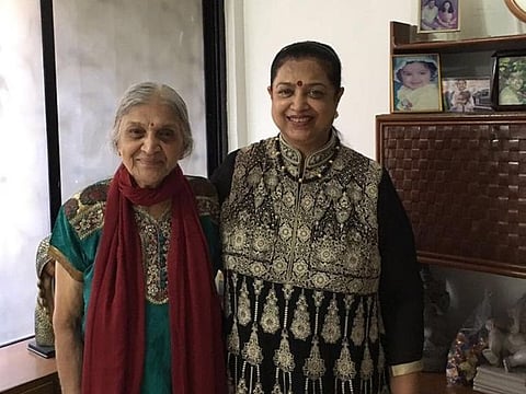 Seventy-one-year old Jaya Gupta (right) has won $1 million in the DDF draw, she is pictured here with her mother (left)