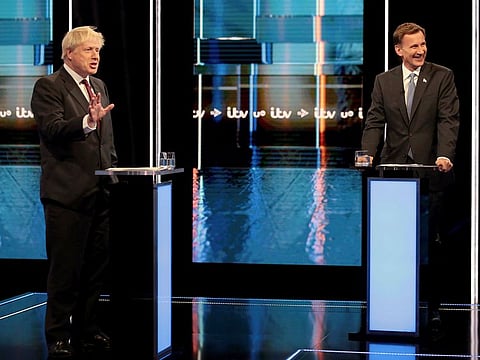 Britain's Conservative Party leadership candidates Boris Johnson, left, and Jeremy Hunt, during a live head-to-head TV debate hosted by ITV.