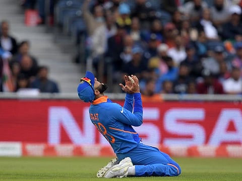 India's captain Virat Kohli reacts after a missed run out attempt.