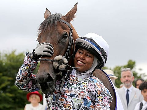 British Jockey Khadijah Mellah cuddles Haverland after winning the all-female Magnolia Cup during day three of Glorious Goodwood.