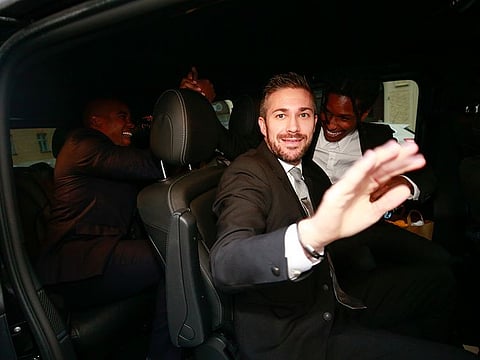 A$AP Rocky, right, leaves the district court after the third day of his trial in Stockholm, Friday, Aug. 2, 2019.