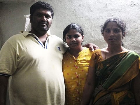 Indian rice farmer Vilas Rikkala, with his family in Hyderabad, India. Rikkala won the Big Ticket raffle on Saturday in Abu Dhabi with ticket number 223805.