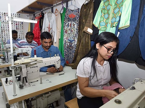 Tailors at Tailormade in Jumeirah Lake Towers are finishing up to seven outfits each a day to meet Eid rush.