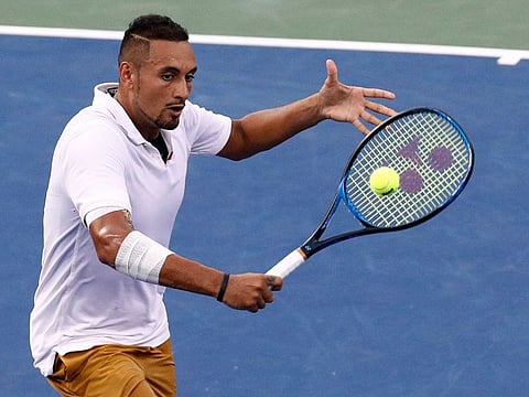 Nick Kyrgios, of Australia, returns the ball to Stefanos Tsitsipas, of Greece, during a semifinal at the Citi Open tennis tournament, on Saturday, in Washington.