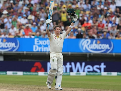 Australia's Steve Smith celebrates after reaching his century during play on the fourth day of the first Ashes cricket Test match between England and Australia at Edgbaston in Birmingham, central England on August 4, 2019.