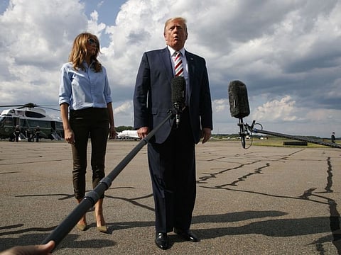 Morristown: President Donald Trump, with first lady Melania Trump, speaks to the media about the recent mass shootings in El Paso, Texas, and Dayton, Ohio, before boarding Air Force One in Morristown, N.J., Sunday, Aug. 4, 2019, to return to Washington.