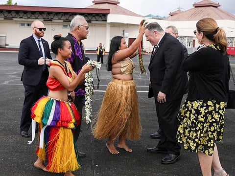 U.S. Secretary of State Mike Pompeo and his wife Susan are greeted by women with traditional mwar mwar floral wreaths as they arrive aboard his plane at Pohnpei International Airport in Kolonia, Federated States of Micronesia August 5, 2019.
