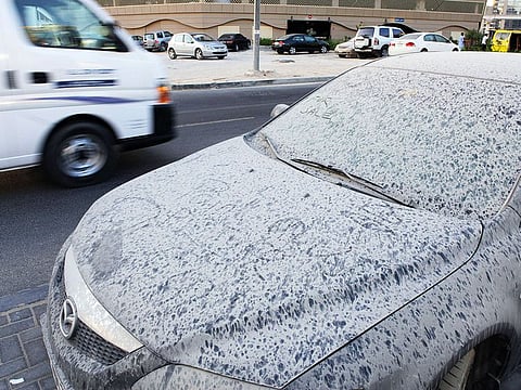 A dust-covered abandoned cars in Tecom area of Dubai