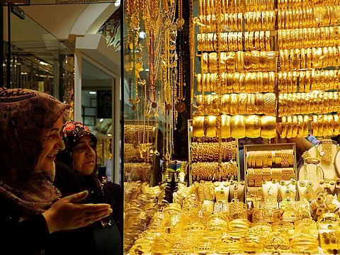 File photo: Women look at gold jewelleries at a jewellery shop in Istanbul.