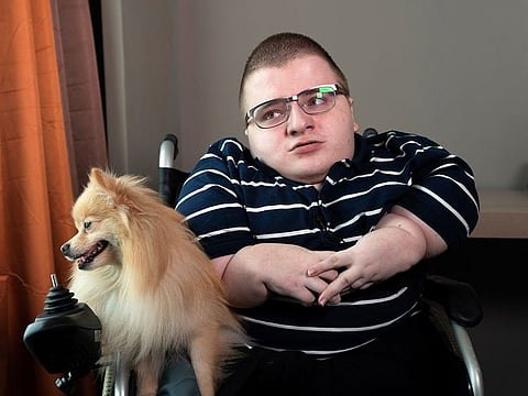 Online message board 8chan creator Fredrick Brennan listens to questions during an interview in Manila, Philippines.