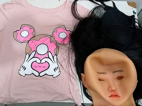 The mask, wig and women's clothing that was used by a man authorities identify as jailed Brazilian drug trafficker Clauvino da Silva, alias “Baixinho,” which means "Shorty," in an attempt to escape from jail in Rio de Janeiro, Brazil.