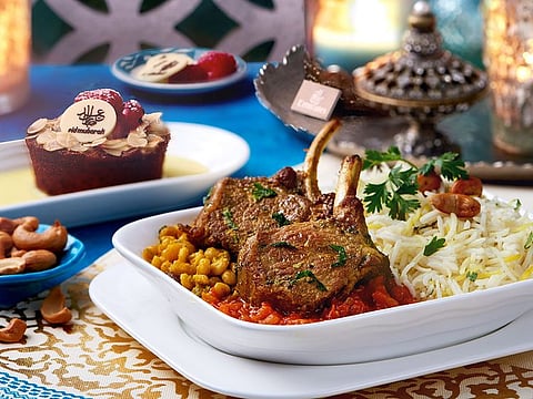Emirates Eid menu:Lamb Ouzi served in Business Class - a rice dish popular in the Gulf where the meat is slow cooked with roasted nuts and raisins.