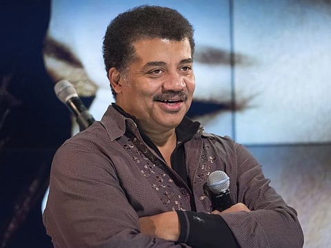 FILE - In this Wednesday, Nov. 1, 2017 file photo, Neil deGrasse Tyson attends a fan event celebrating the release Kelly Clarkson's album "Meaning of Life" at YouTube Space New York in New York. The astrophysicist will keep his job as head of the Hayden Planetarium at New York’s American Museum after the museum concluded its investigation into sexual misconduct charges against him. (Photo by Charles Sykes/Invision/AP, File)