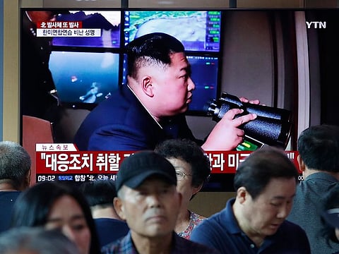 People watch a TV showing a file image of North Korean leader Kim Jong Un during a news program at the Seoul Railway Station in Seoul, South Korea, Tuesday, Aug. 6, 2019.