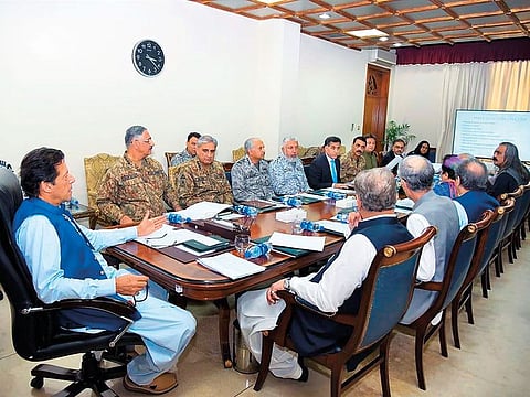 Prime Minister Imran Khan chairs a National Security Committee meeting along with armed forces chiefs and other government officials in Islamabad.