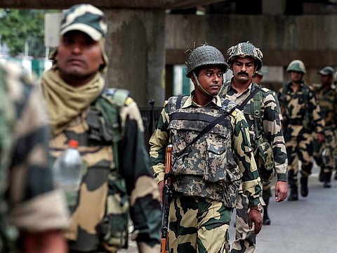 Indian security forces personnel patrol a deserted street during restrictions after the government scrapped special status for Kashmir, in Srinagar August 7, 2019.