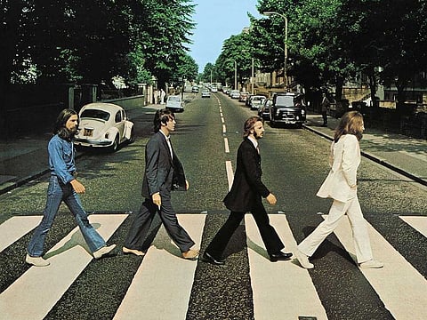 Members of the Beatles, George Harrison, Paul McCartney, Ringo Starr, John Lennon, cross Abbey Road in London, Britain.