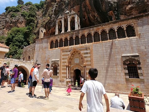 People are seen at the Monastery of Saint Anthony of Qozhaya in the heart of the Qadisha valley, in Zgharta district, Lebanon June 23, 2019.