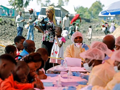 A woman and child wait to receive the Ebola vaccination in Goma, Democratic Republic of Congo.
