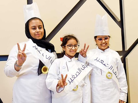 Winning team members Maha Fouad Abdullah, Fatima Ali and Shahar Abdul Halim at the closing ceremony of the 3rd edition of “Junior Chef” in Sharjah
