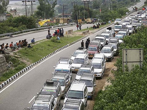 Taxis stand parked roadside during restrictions in Jammu, Friday, Aug 9, 2019