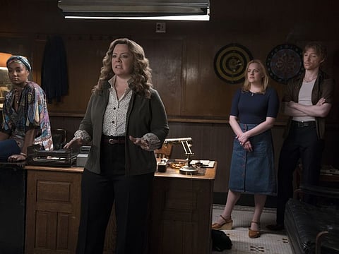 This image released by Warner Bros. Pictures shows, from left, Tiffany Haddish, Melissa McCarthy, Elisabeth Moss and Domhnall Gleeson in a scene from "The Kitchen." (Alison Cohen Rosa/Warner Bros. Pictures via AP)