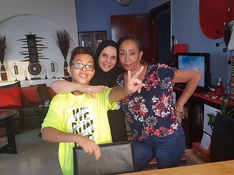 Amal Hassan (right) and her nephew during a visit to her friend Manara’s house for Eid.