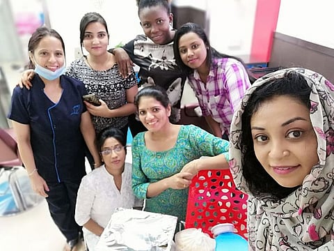 Reshma Sainulabdeen with ladies at a salon.