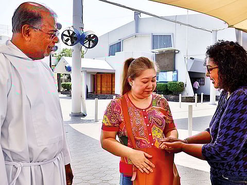 Anne (centre) with Fr Lennie J. A. Connully from St Mary’s Catholic Church Dubai and social worker Susan Jose. The church’s Samaritan Ministry helped Anne apply for a fine waiver.