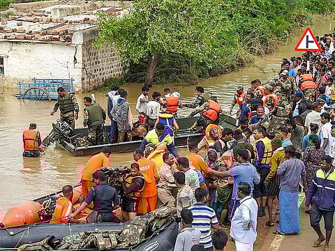 National Disaster Response Force (NDRF) members and army personel carry out rescue operations in flood-affected areas of Bagalkot district.