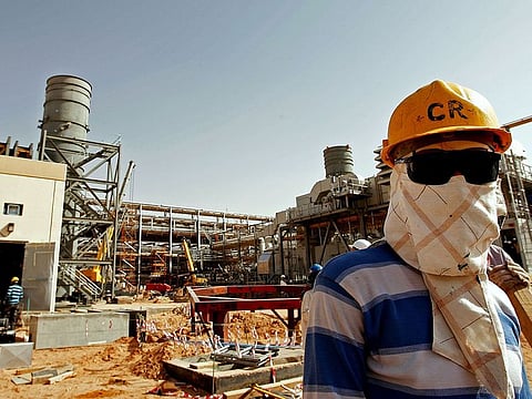 A worker at the site of Saudi Aramco's Al Khurais central oil processing facility, 160km east of the capital Riyadh. Illustrative image.