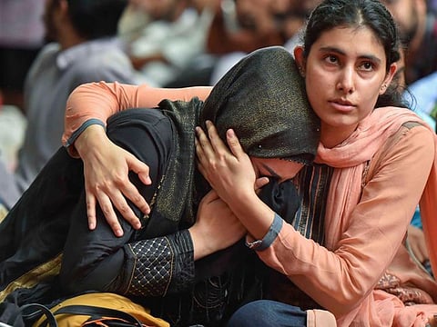 A Muslim woman gets emotional as she celebrates Eid with Kashmiri students in New Dehli.