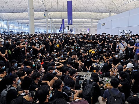 Illustrative picture from August 12: Protesters gather near an information board during a protest at the Hong Kong International Airport, Monday, Aug. 12, 2019.