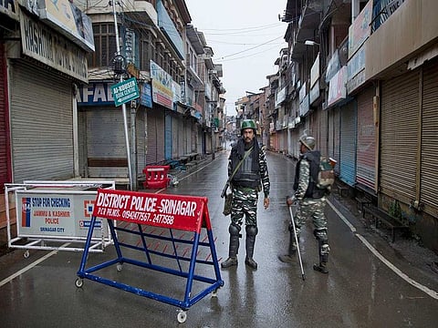 Indian paramilitary soldiers stand guard during a security lockdown in Srinagar, Indian administered Kashmir, Wednesday, August 14, 2019.