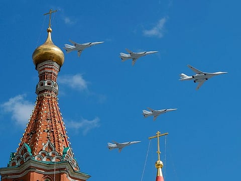 Russian army Tupolev Tu-160 (R) and Tupolev Tu-22M3 fly in formation over St. Basil's Cathedral during the rehearsal for the Victory Day parade in Moscow, Russia May 4, 2019.