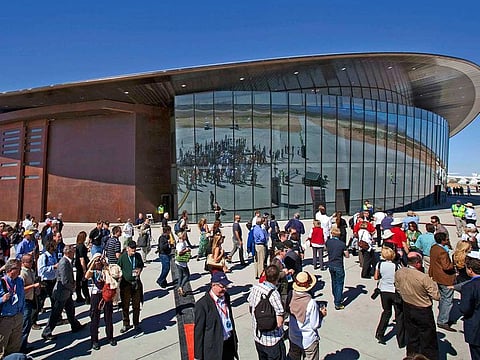 In this Oct. 17, 2011 file photo, guests stand outside the new Spaceport America hangar in Upham, N.M.